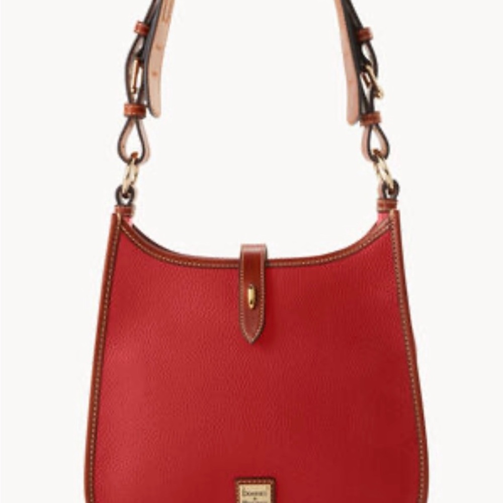 Dooney and Burke purse brand new! Beautiful bag just not enough room for me !